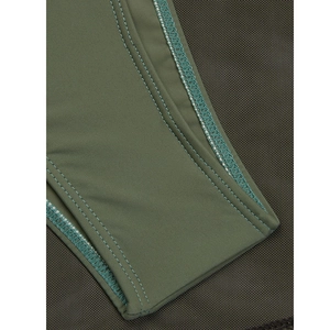 Detailed close-up of high-elastic olive green fabric and professional reinforced stitching