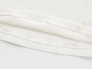 Macro shot of fine knitted fabric texture and flat double-needle hem stitching detail