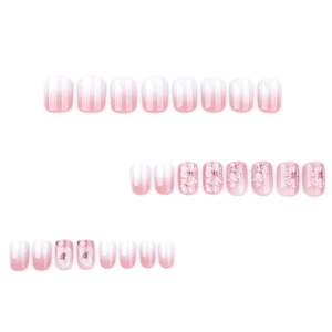 Pink and white ombre press-on nails with delicate cherry blossom designs and short square shape