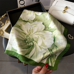 Green and white floral silk square scarf with lotus print and elegant dark green border