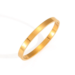 Minimalist gold stainless steel open bangle with a polished mirror finish on white background