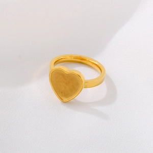 Golden heart-shaped stainless steel ring blank with flat setting shown at a 45-degree angle