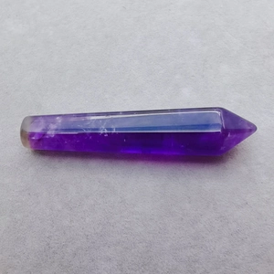 Macro detail of natural purple amethyst hexagonal prism crystal column for healing decor