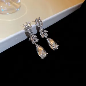 Silver needle drop earrings with sparkling wheat ear zircon and pear shaped tassels