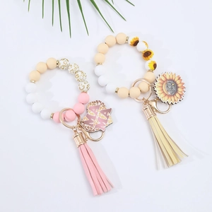 Silicone beaded wristlet keychains with floral charms and tassels for Mother's Day