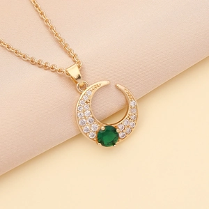 Gold moon necklace with tiny white diamonds and green round zircon stone pendant