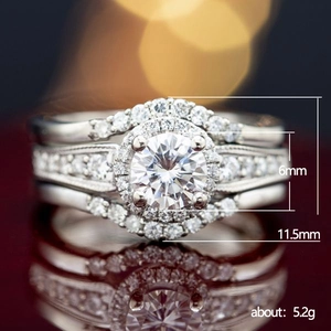 Three-piece silver bridal ring set with halo design sparkling round cubic zirconia
