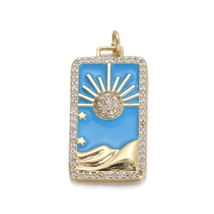 Detail of gold sun and hand pendant with blue enamel and sparkling small rhinestones