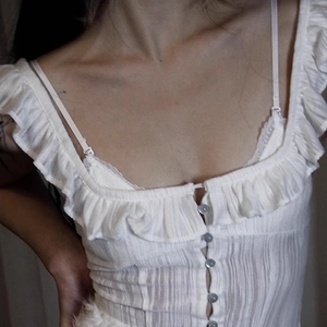 French lace triangle cup bralette in white with pleated texture and button detail