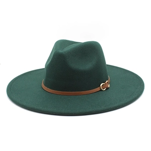 Detail of dark green wool felt fedora featuring a brown leather band and gold horseshoe buckle