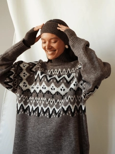 Detail of Fair Isle pattern on brown knit sweater and matching headband set for women