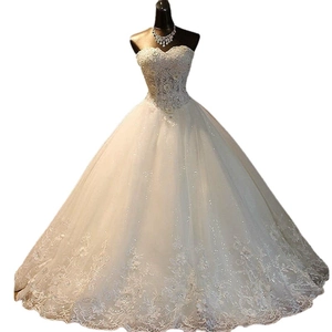 Elegant strapless wedding dress with sequined bodice and tiered lace floor-length skirt