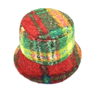 Detailed macro of the colorful plush faux fur texture and warm fuzzy fabric of this bucket hat