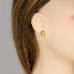 Minimalist 18k gold plated 304 stainless steel sunflower stud earrings worn by a model