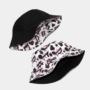Reversible bucket hat with black side and colorful music note print for outdoor travel