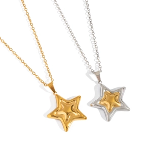 Gold and silver star pendant necklaces with layered design on a white background