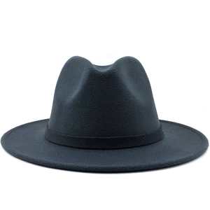 Detail of a black wool felt fedora featuring a wide flat brim and matching ribbon band