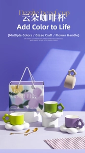 Ceramic coffee cup set with cloud saucers and golden spoons in floral gift packaging