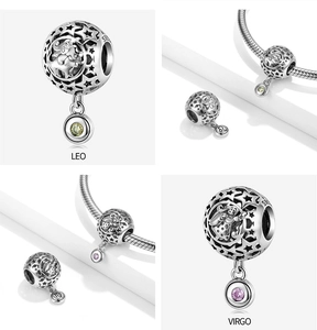 Macro view of S925 sterling silver Leo and Virgo zodiac star charms with colored gems
