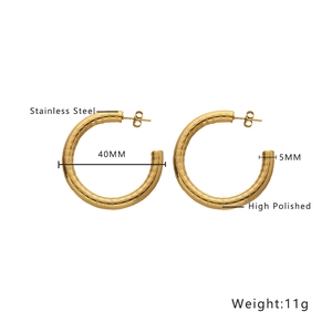 Detailed view of high polished gold stainless steel earrings with 40mm diameter and 11g weight