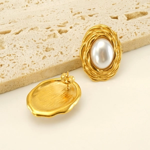 Retro gold woven metal earrings with large oval white pearls shown in front and back view