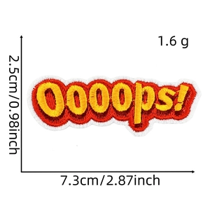 Macro shot of embroidered Ooops patch with red letters on yellow background and white border
