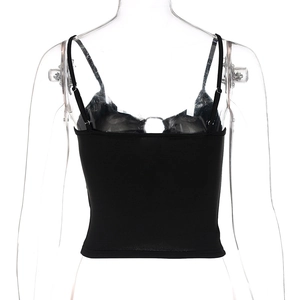 Detail view of the back of a black spaghetti strap crop top with elastic knit fabric