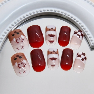 Christmas press-on nails with Santa Claus, elk, and red plaid patterns on mirror base