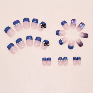 Detailed set of glacial blue French nails with 3D black bows and pearl accents