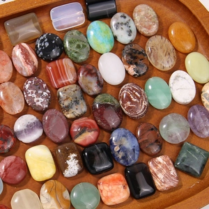 Variety of natural stone cabochons in geometric shapes for DIY jewelry making and crafts