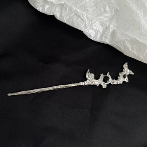 Detail of silver lava texture hair pin with black gemstone in neo-Chinese style