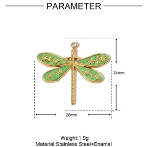 Detailed view of a green enamel dragonfly pendant with gold stainless steel edges