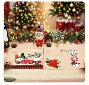 Detail of Christmas burlap placemats and wine bottle cover with festive embroidery