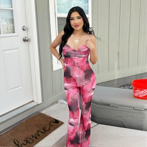 Detail of pink and black marble print jumpsuit with spaghetti straps and flared legs