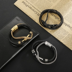 Detail view of woven leather bracelets in black, gold, and silver with magnetic clasps