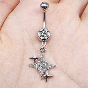 Detail of silver heart navel ring with sparkling cubic zirconia pendant on palm