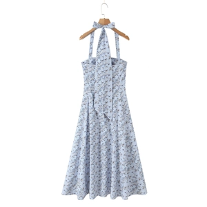 Detail of light blue floral dress with elegant halter neck tie and open back design