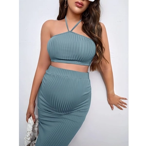 Detail of grey-blue ribbed knit maternity set featuring elastic halter top and pencil skirt