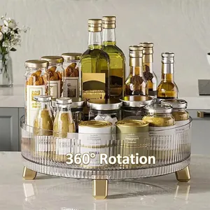 360-degree rotating transparent kitchen organizer with golden legs and vertical stripes