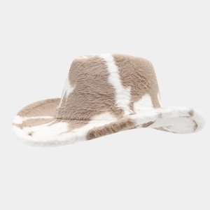 Detail shot of the plush cow print texture on a western-style winter cowboy hat
