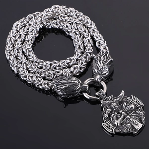 Detailed shot of Viking compass necklace with wolf heads and rune pendant in silver finish