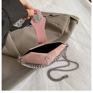 Detail view of pink quilted PU leather chain bag showing the inner compartment and magnetic snap