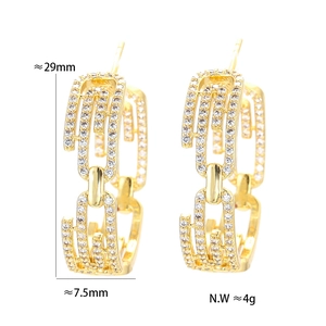 Detail view of gold zircon paperclip earrings with size specs and weight info