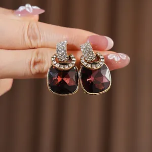 Vintage gold-plated earrings with square red rubies and pave-set rhinestones