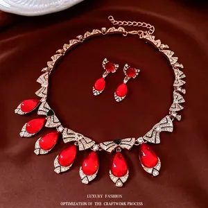 Luxury gold-plated vintage jewelry set with red waterdrop gems and sparkling zircons