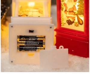 Detailed view of the Christmas night light base showing the 3 AAA battery compartment