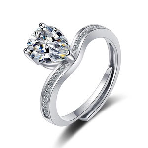 Adjustable silver ring with pear-cut cubic zirconia and small accent side stones
