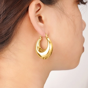 Minimalist gold inverted triangle hoop earrings with a high-polished mirror finish