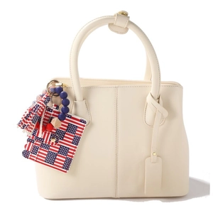 Detail of cream PU leather card holder with American flag pattern and beaded tassel keychain