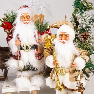 Detail of 12-inch standing Santa Claus figures with gifts, skis, and luxury gold outfits